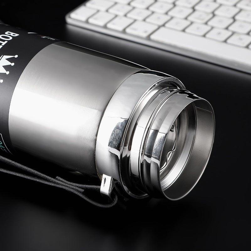 Gobelet isotherme en acier inoxydable – Bouteille type “balle” avec sangle